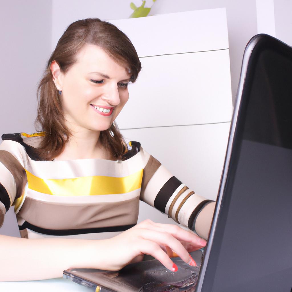 Woman typing on laptop, smiling