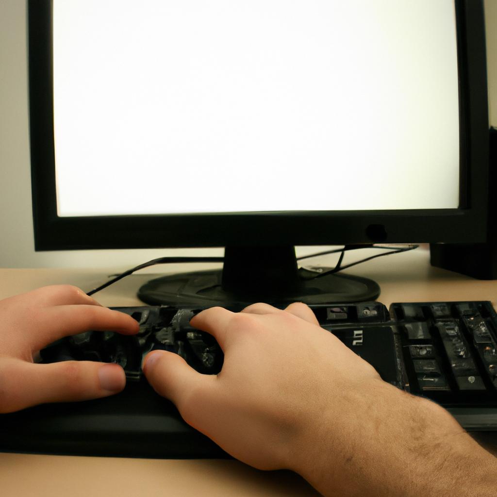 Person typing on computer screen